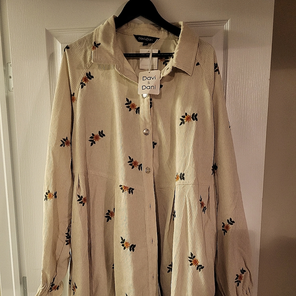 Swing style corduroy dress.  With embroidery flowers. With pockets